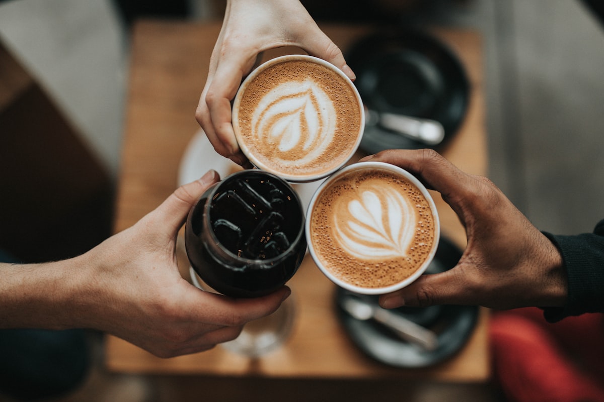 Fresh coffee beside pastry